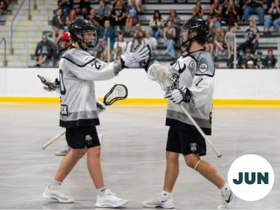 Two people in Northmen lacrosse uniforms